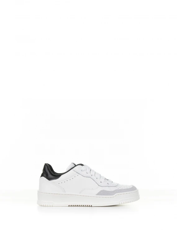 White leather sneaker with black heel