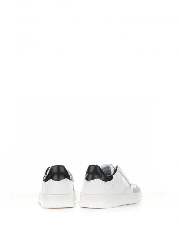 White leather sneaker with black heel