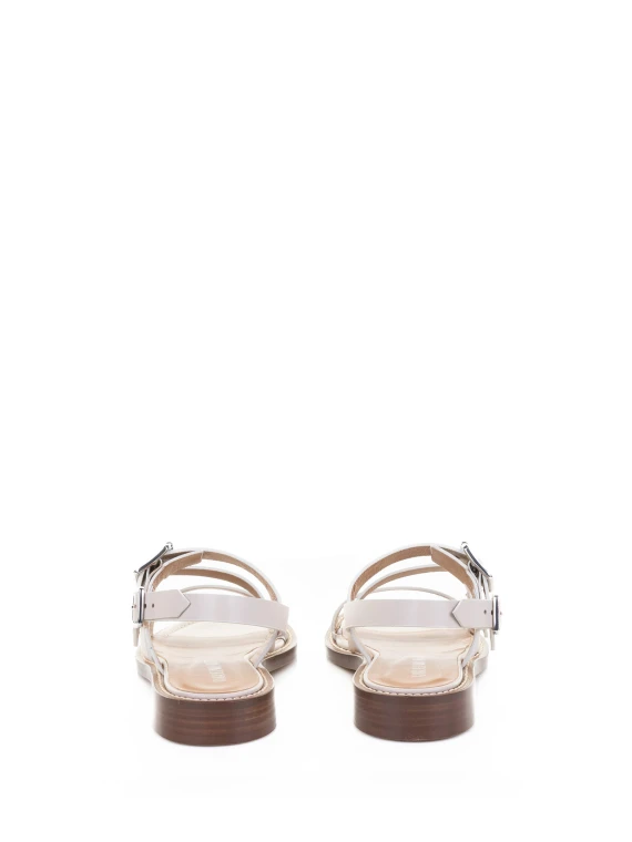 Low white sandal with buckles