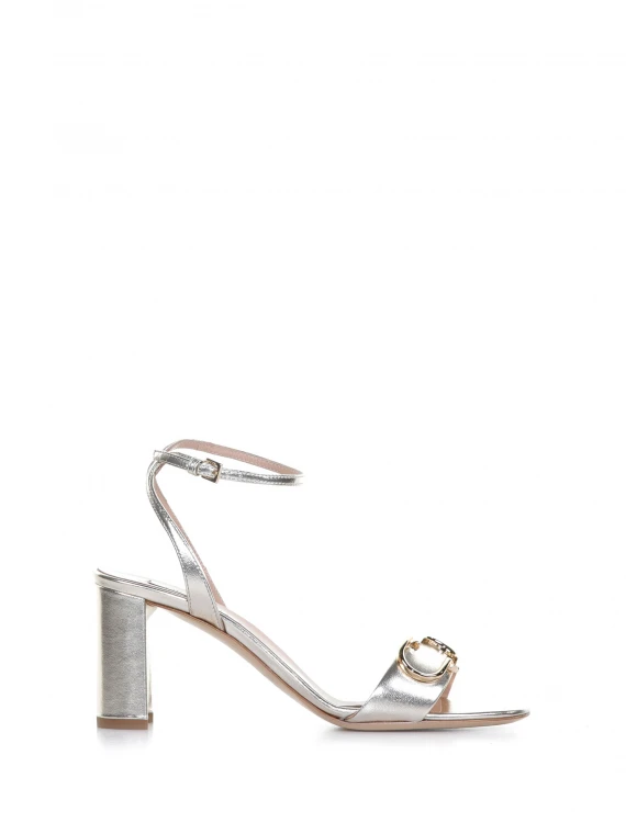 Sandal with heel and strap